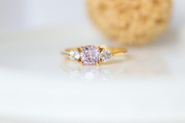 Three stone peach sapphire ring
